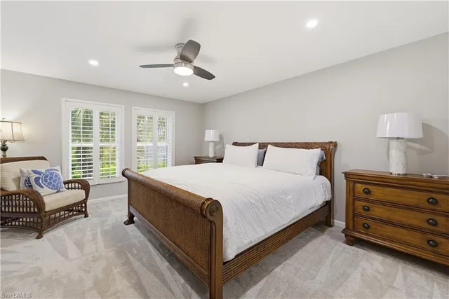 a spacious bedroom with a bed and a couch