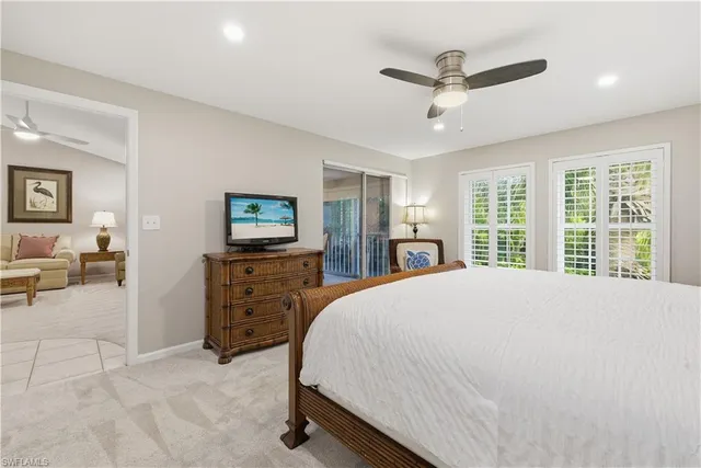 a bed room with a bed and a television