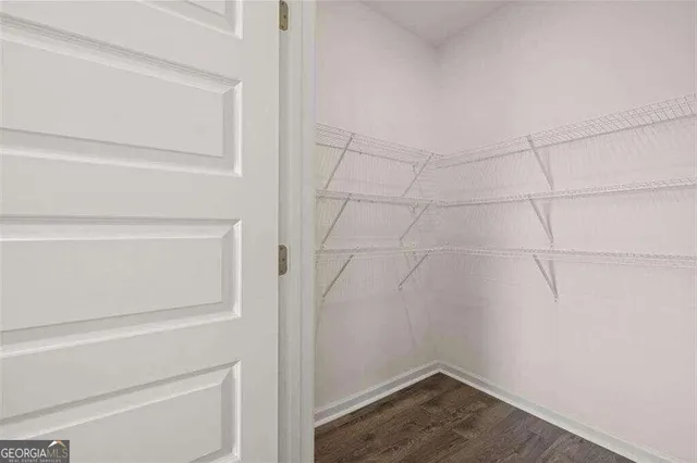 a view of an empty walk in closet