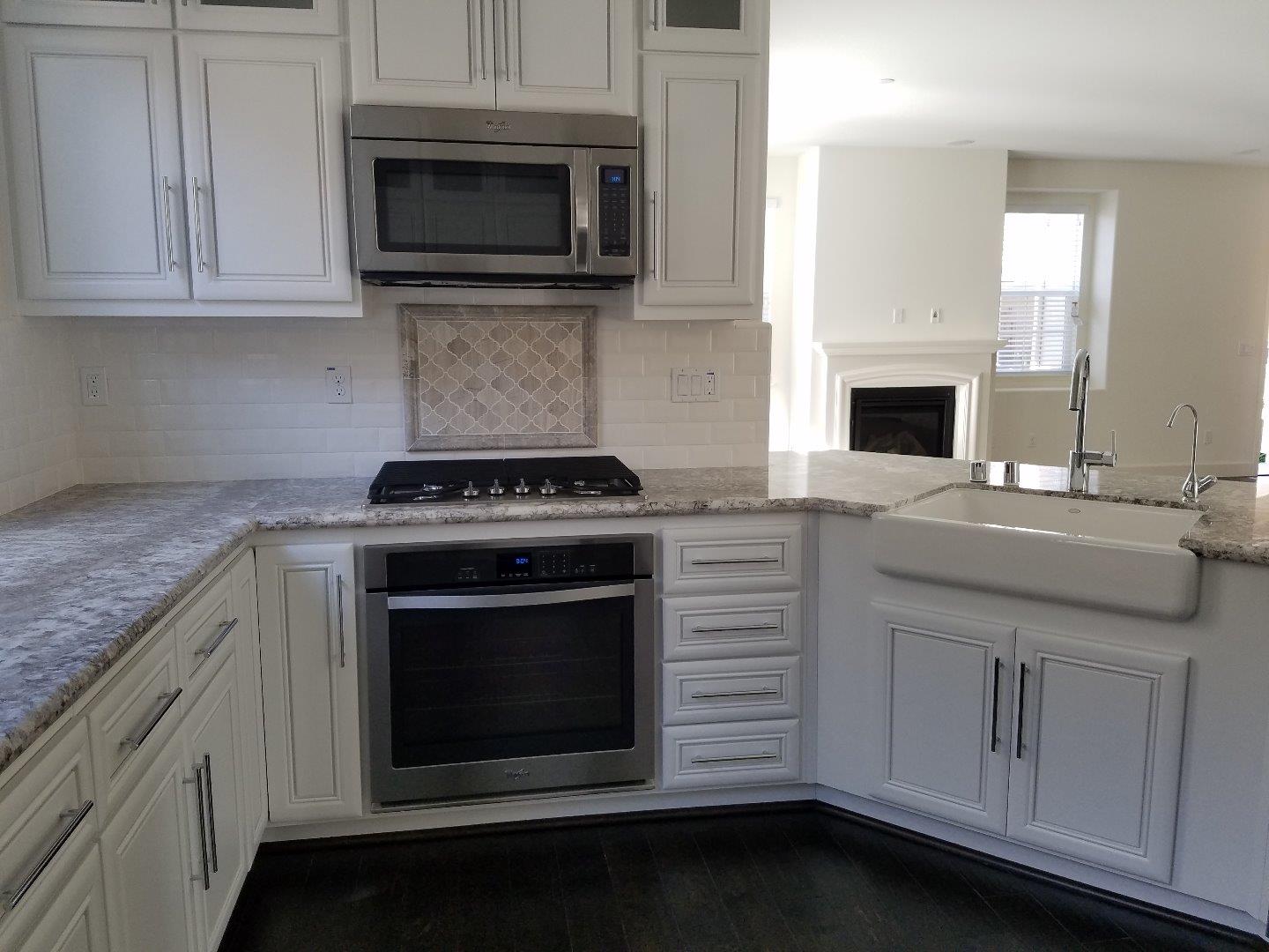 Caspian Way Gilroy, CA 95020 - Photo 5 of 13 a kitchen with cabinets stainless steel appliances and a sink
