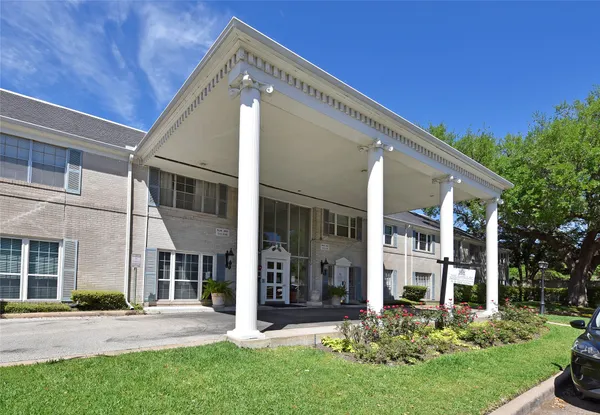 a view of a building with a yard