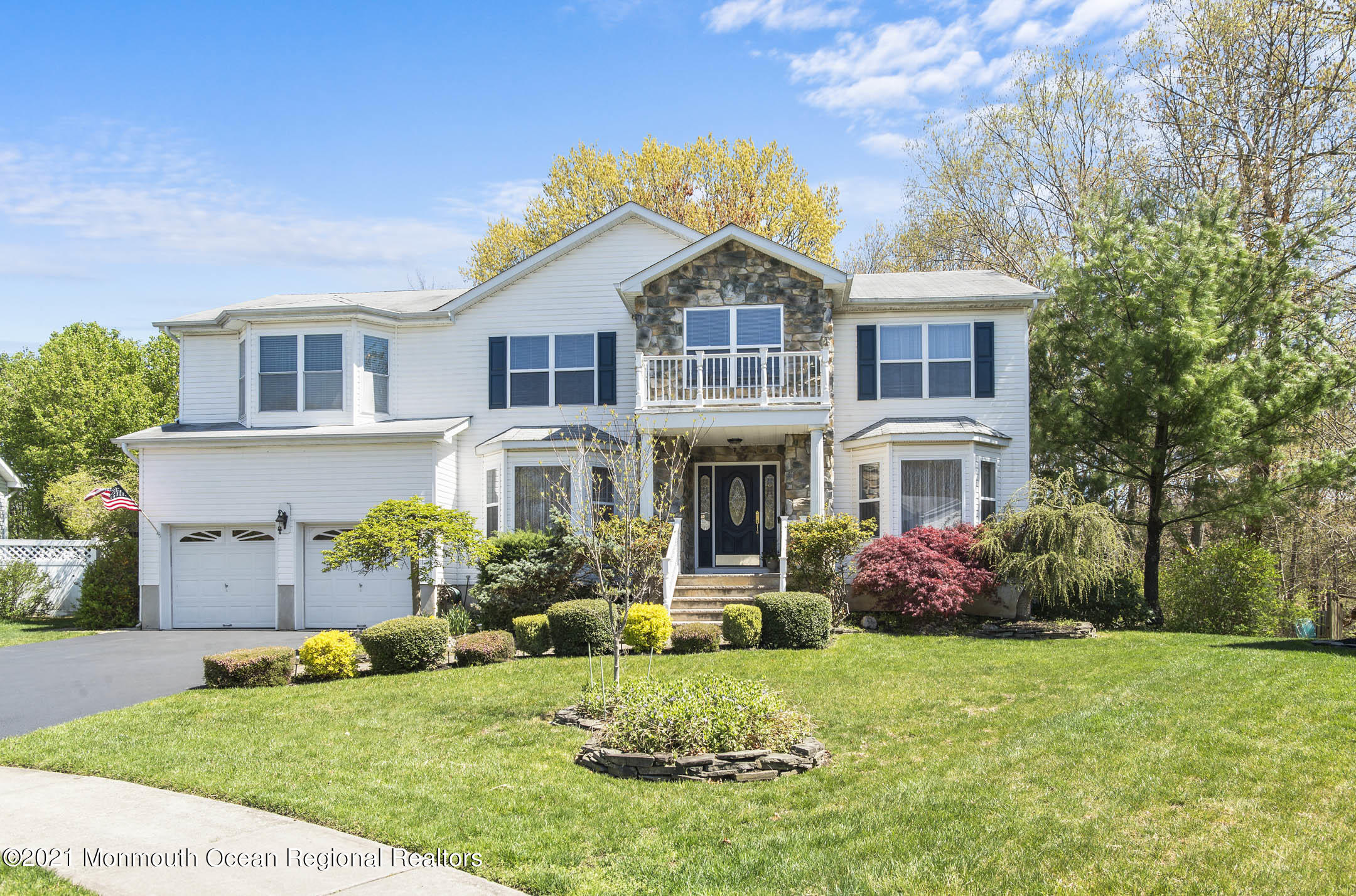 a front view of a house with a yard table and chairs