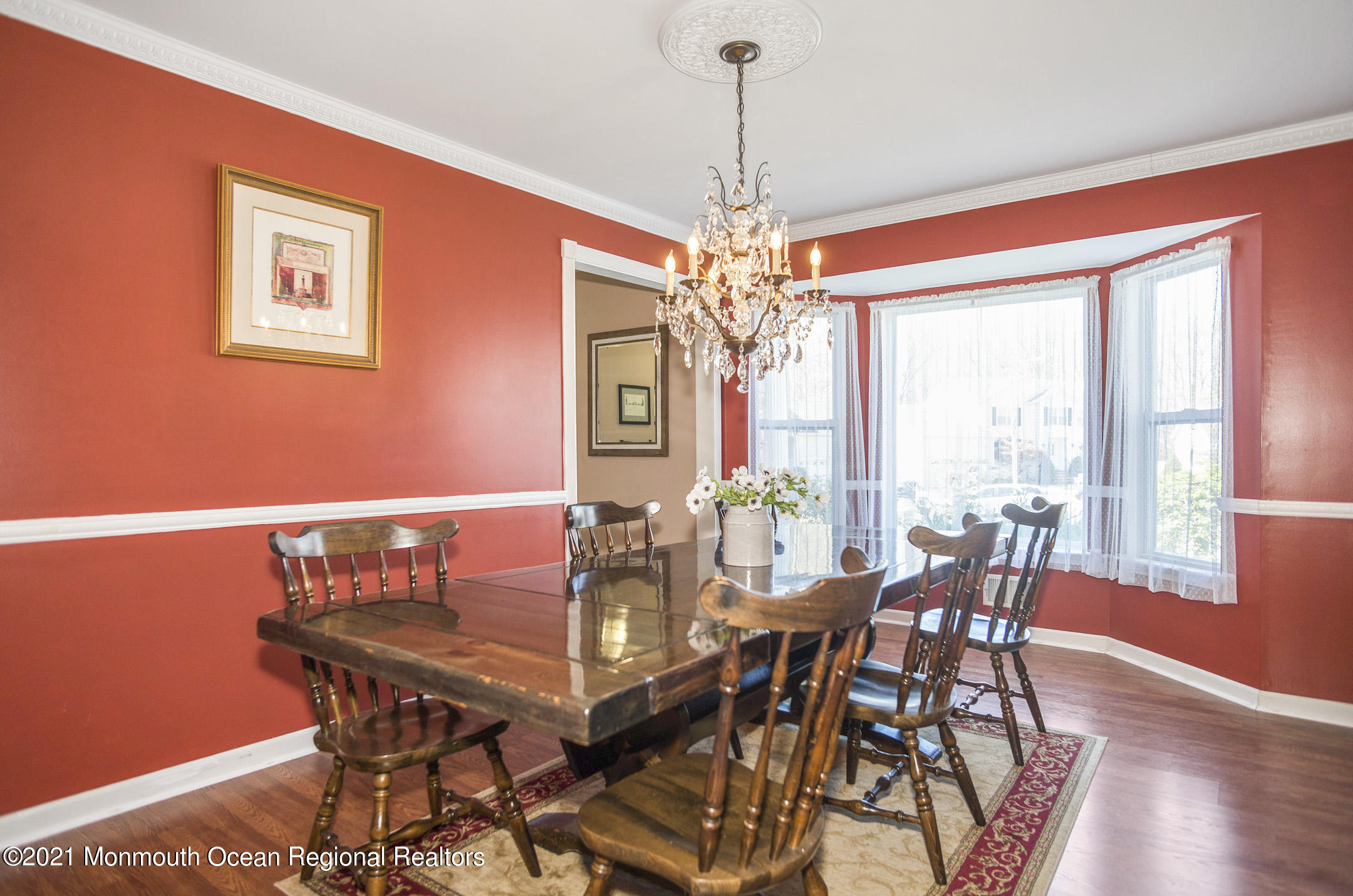 39 Sally Street Howell, NJ 07731 - Photo 19 of 70 a view of a dining room with furniture window and wooden floor