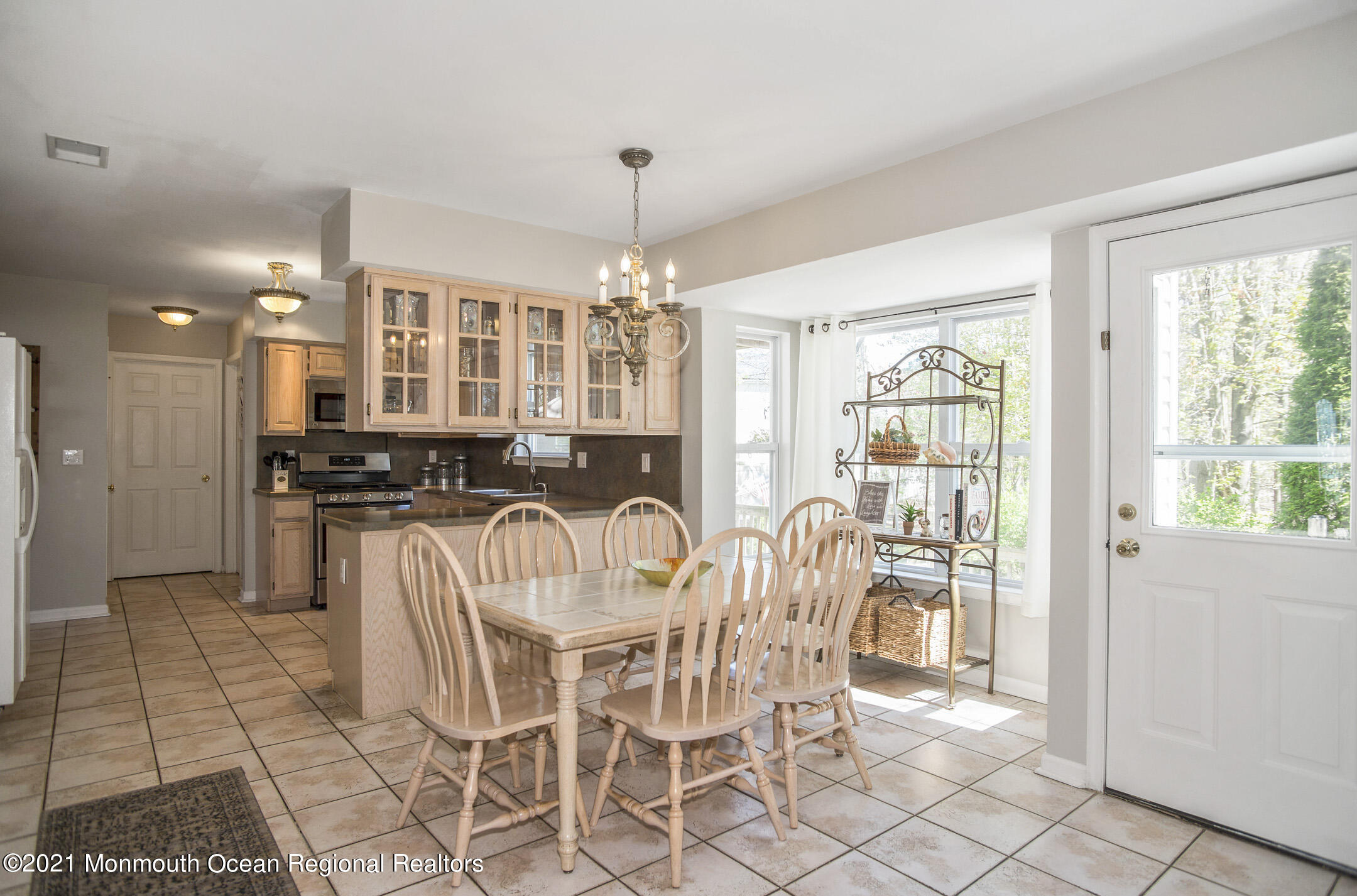 39 Sally Street Howell, NJ 07731 - Photo 29 of 70 a view of a dining room with furniture window and outside view