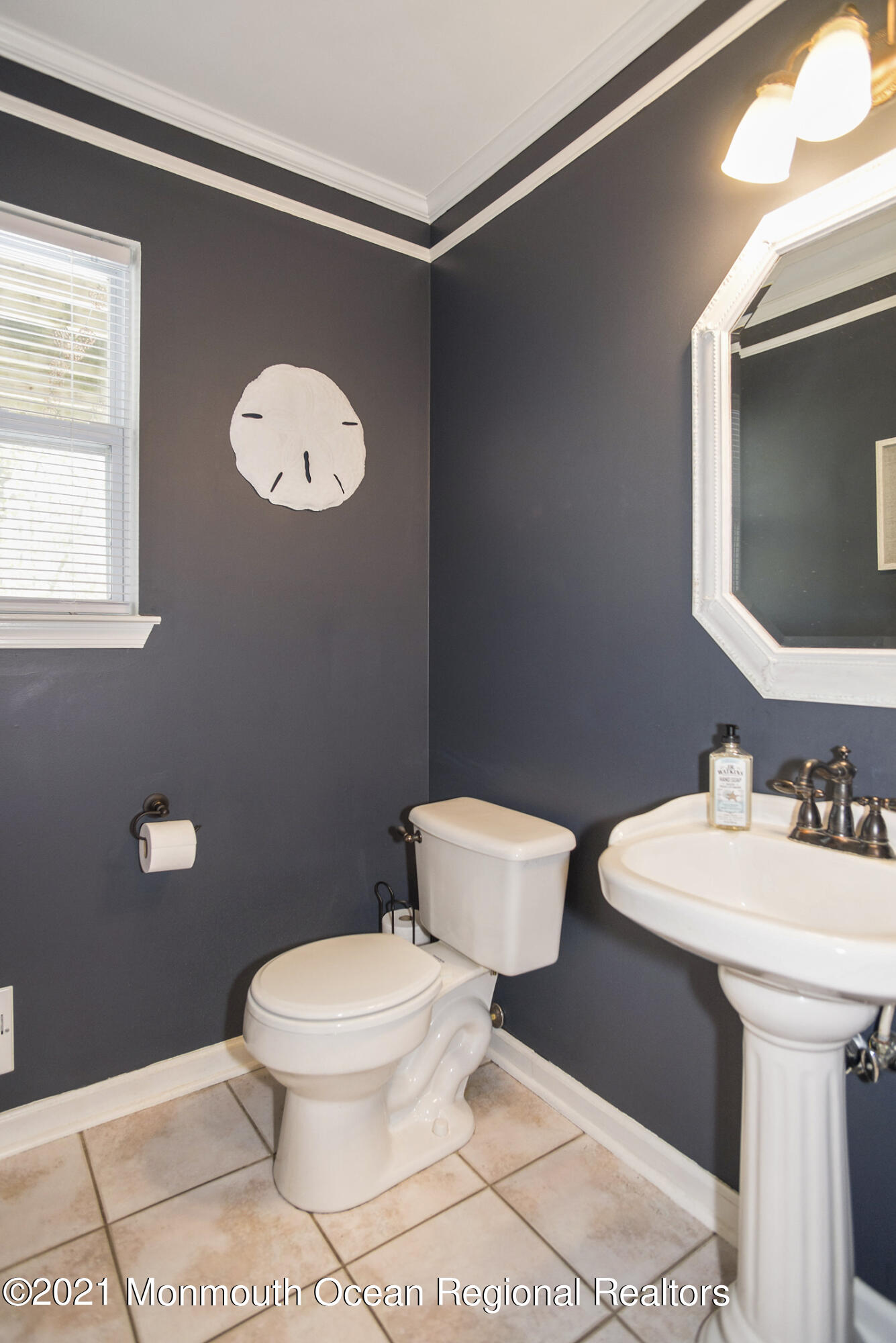 39 Sally Street Howell, NJ 07731 - Photo 30 of 70 a bathroom with a toilet sink and mirror
