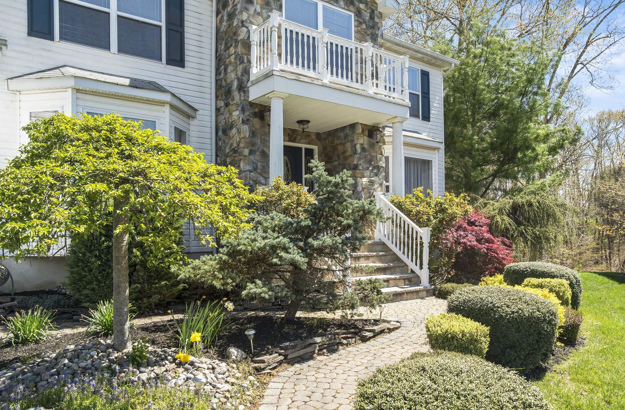 39 Sally Street Howell, NJ 07731 - Photo 4 of 70 a front view of a house with a yard