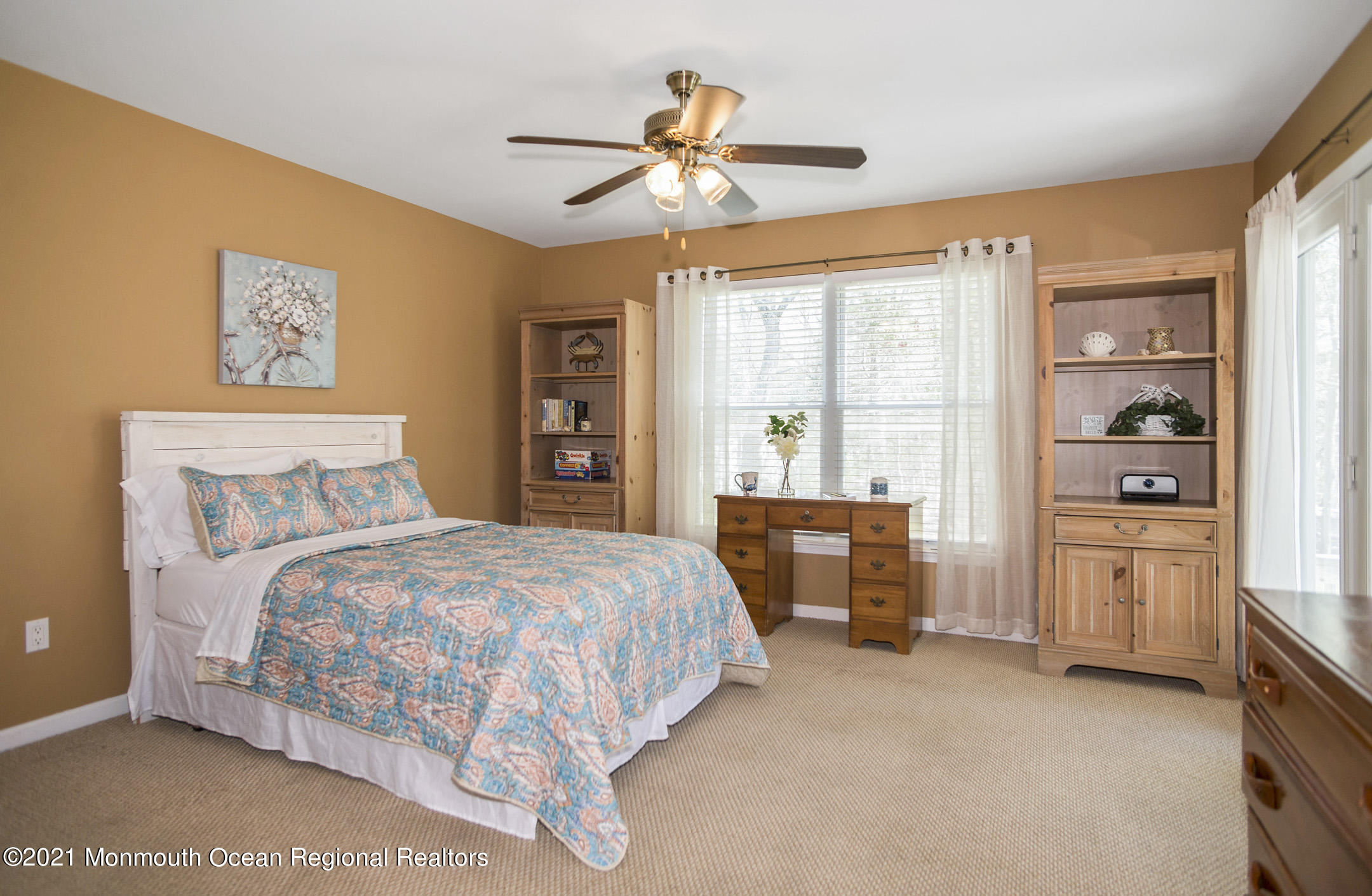 39 Sally Street Howell, NJ 07731 - Photo 31 of 70 a bedroom with a bed and a chandelier