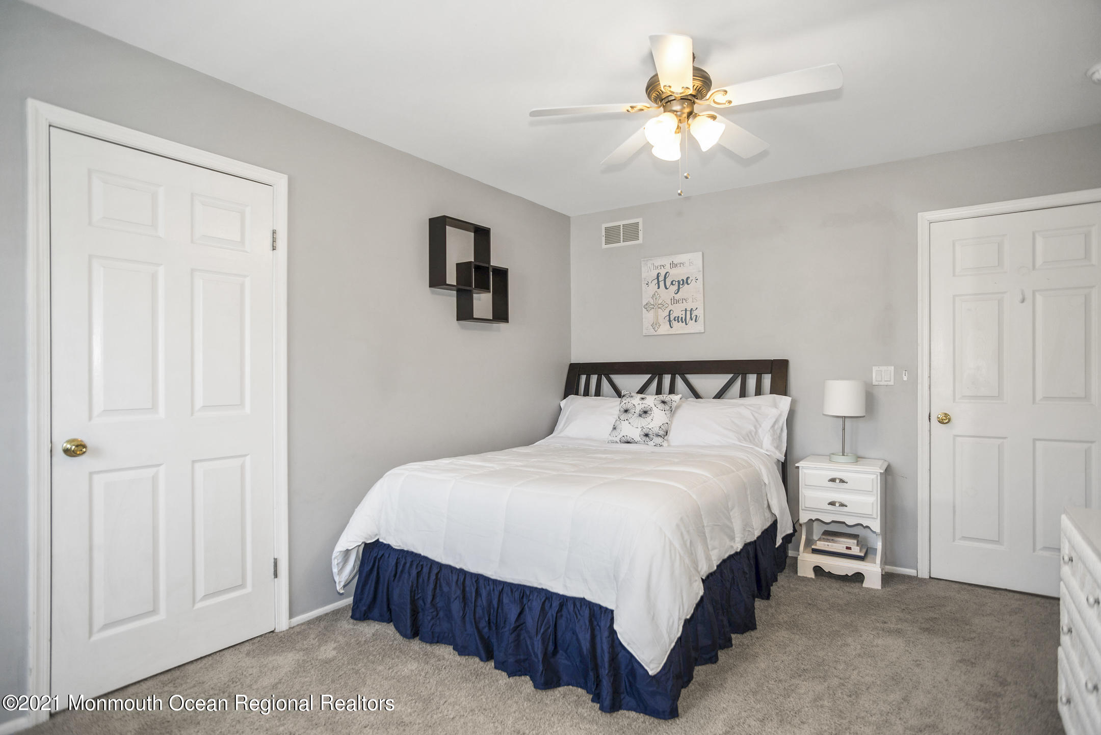 39 Sally Street Howell, NJ 07731 - Photo 41 of 70 a bedroom with a bed and a chandelier