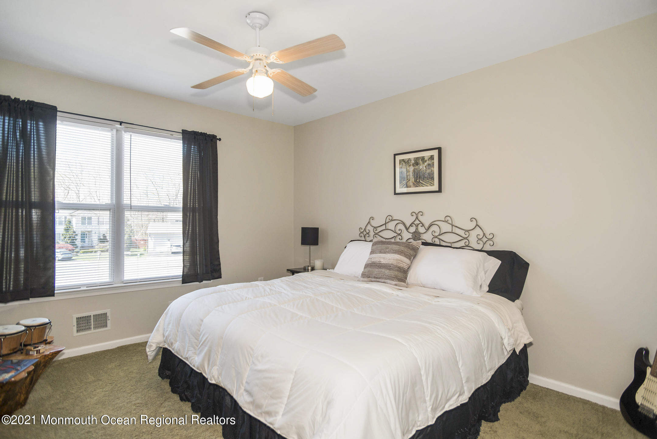 39 Sally Street Howell, NJ 07731 - Photo 44 of 70 a bedroom with a bed and a large window