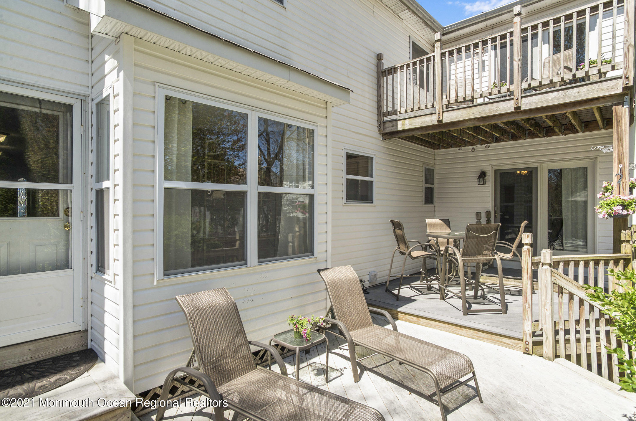 39 Sally Street Howell, NJ 07731 - Photo 55 of 70 a view of a patio with couches table and chairs and potted plants