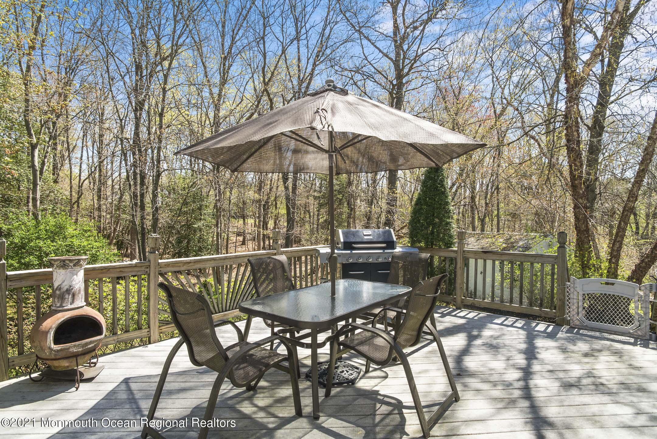 39 Sally Street Howell, NJ 07731 - Photo 56 of 70 a patio with a yard table and chairs