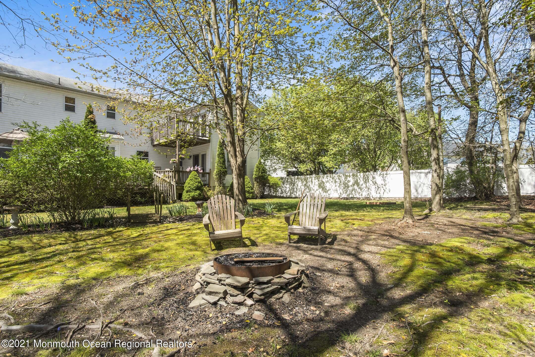 39 Sally Street Howell, NJ 07731 - Photo 58 of 70 a view of a swimming pool with an outdoor space and seating area