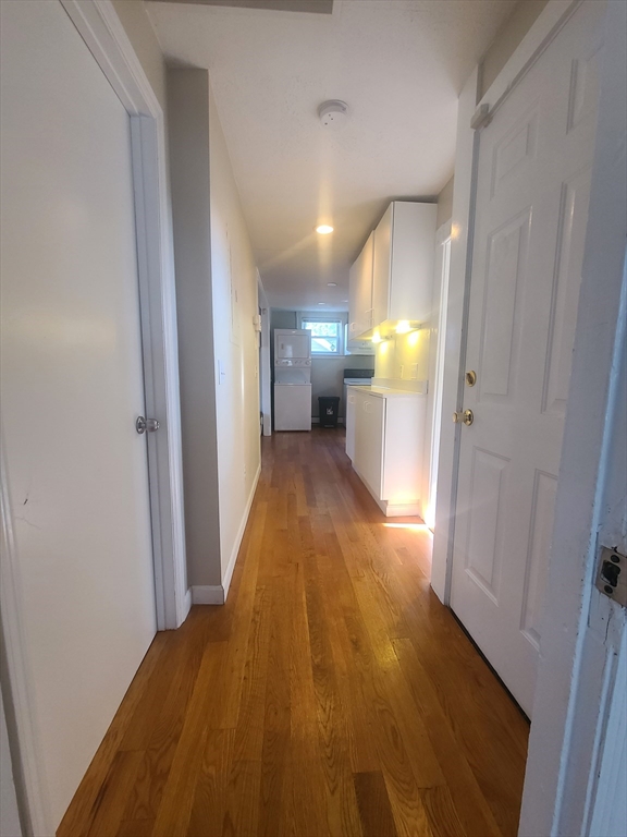 39 Florence Street, Unit 2 Worcester, MA 01610 - Photo 7 of 10 a view of a hallway with wooden floor
