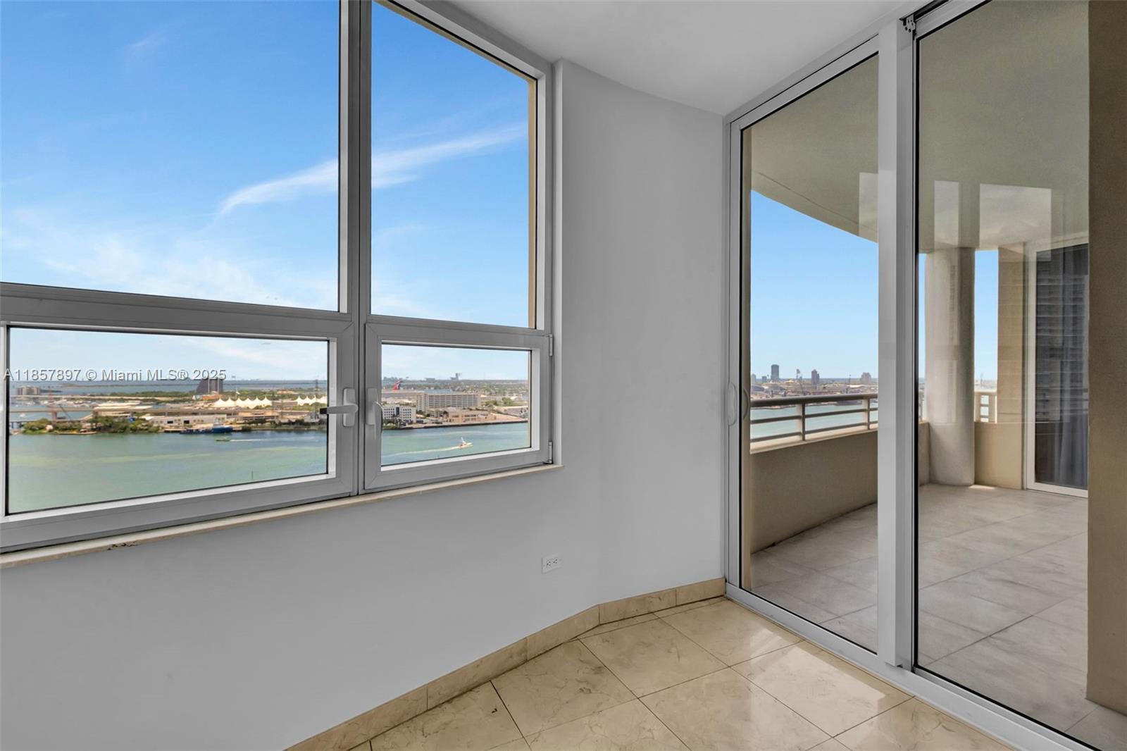 848 Brickell Key Drive, Unit 2602 Miami, FL 33131 - Photo 15 of 40 a view of a living room with a large window