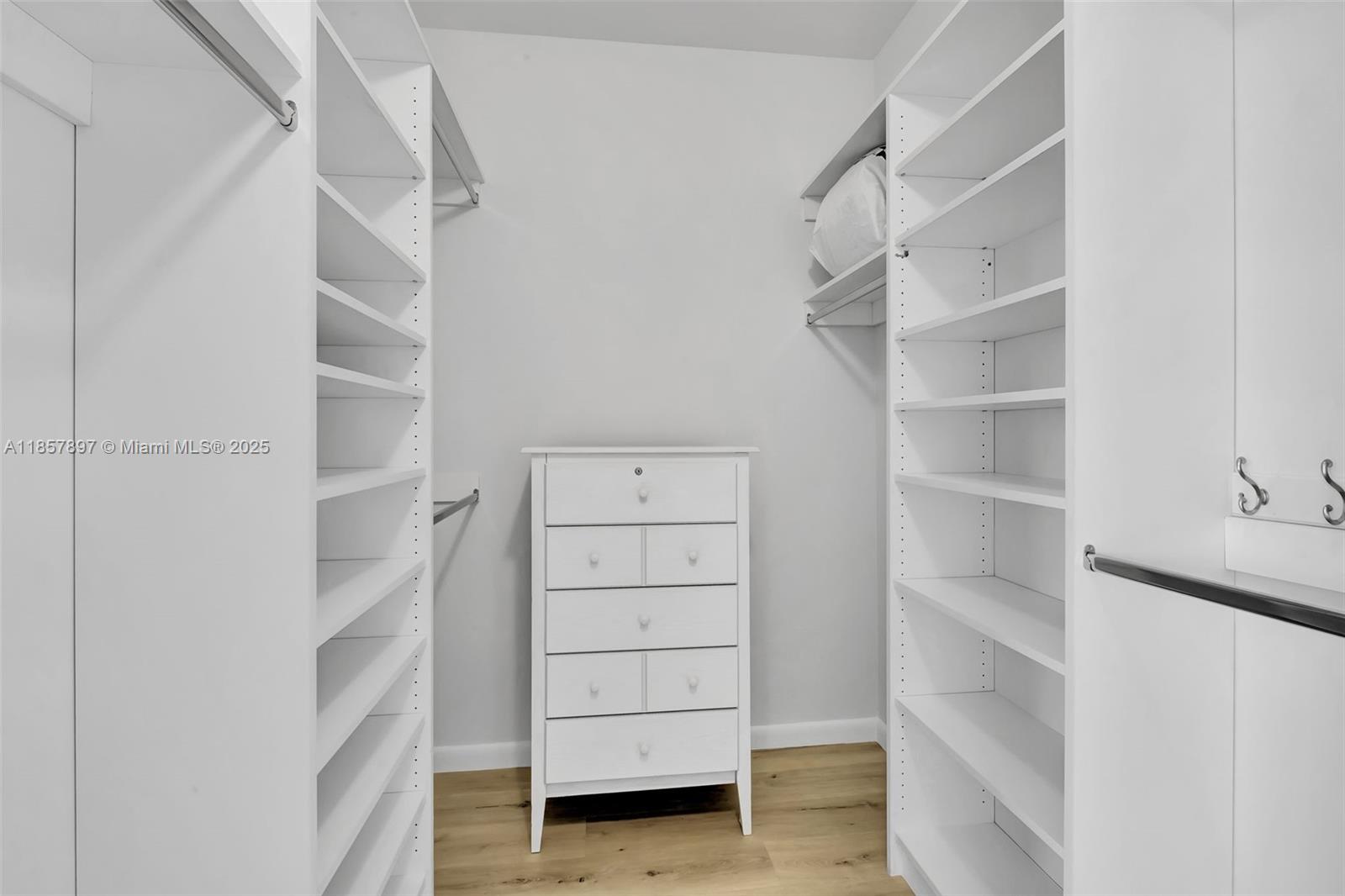 848 Brickell Key Drive, Unit 2602 Miami, FL 33131 - Photo 23 of 40 a view of walk in closet with empty racks