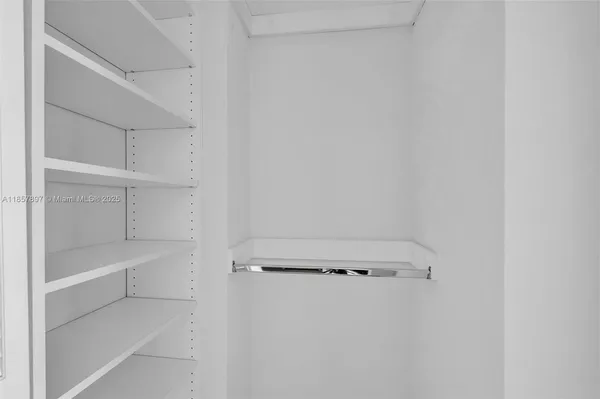 a view of an empty walk in closet