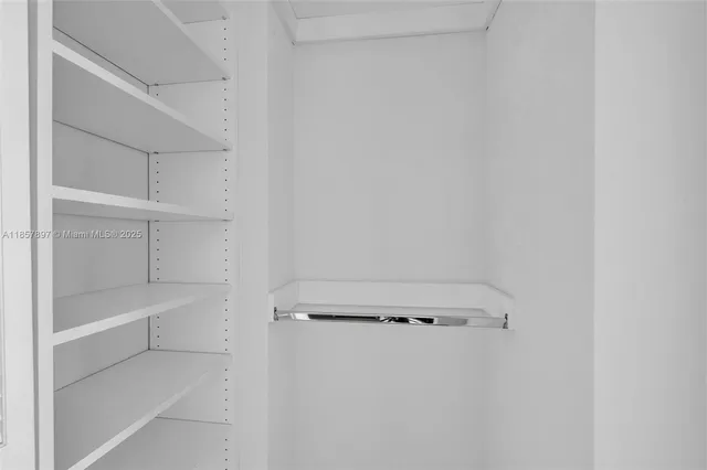 a view of an empty walk in closet