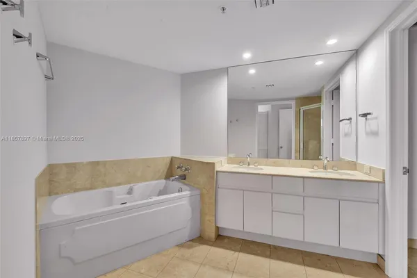 a bathroom with a bathtub and a sink