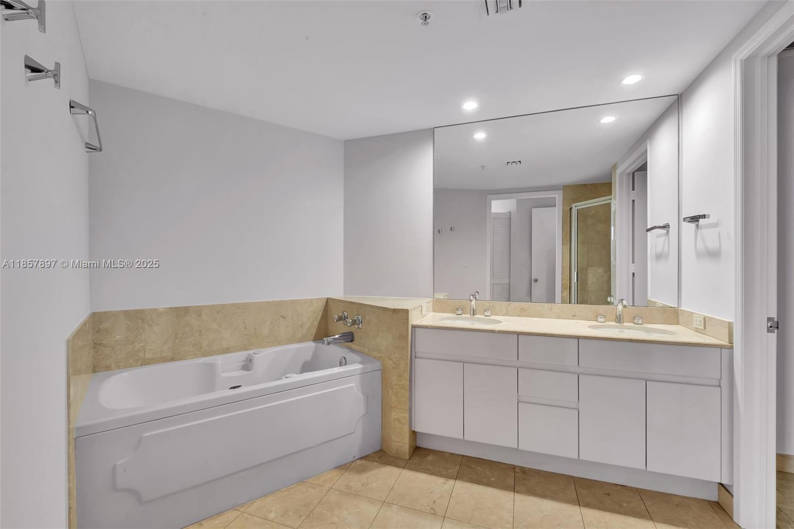 848 Brickell Key Drive, Unit 2602 Miami, FL 33131 - Photo 25 of 40 a bathroom with a bathtub and a sink