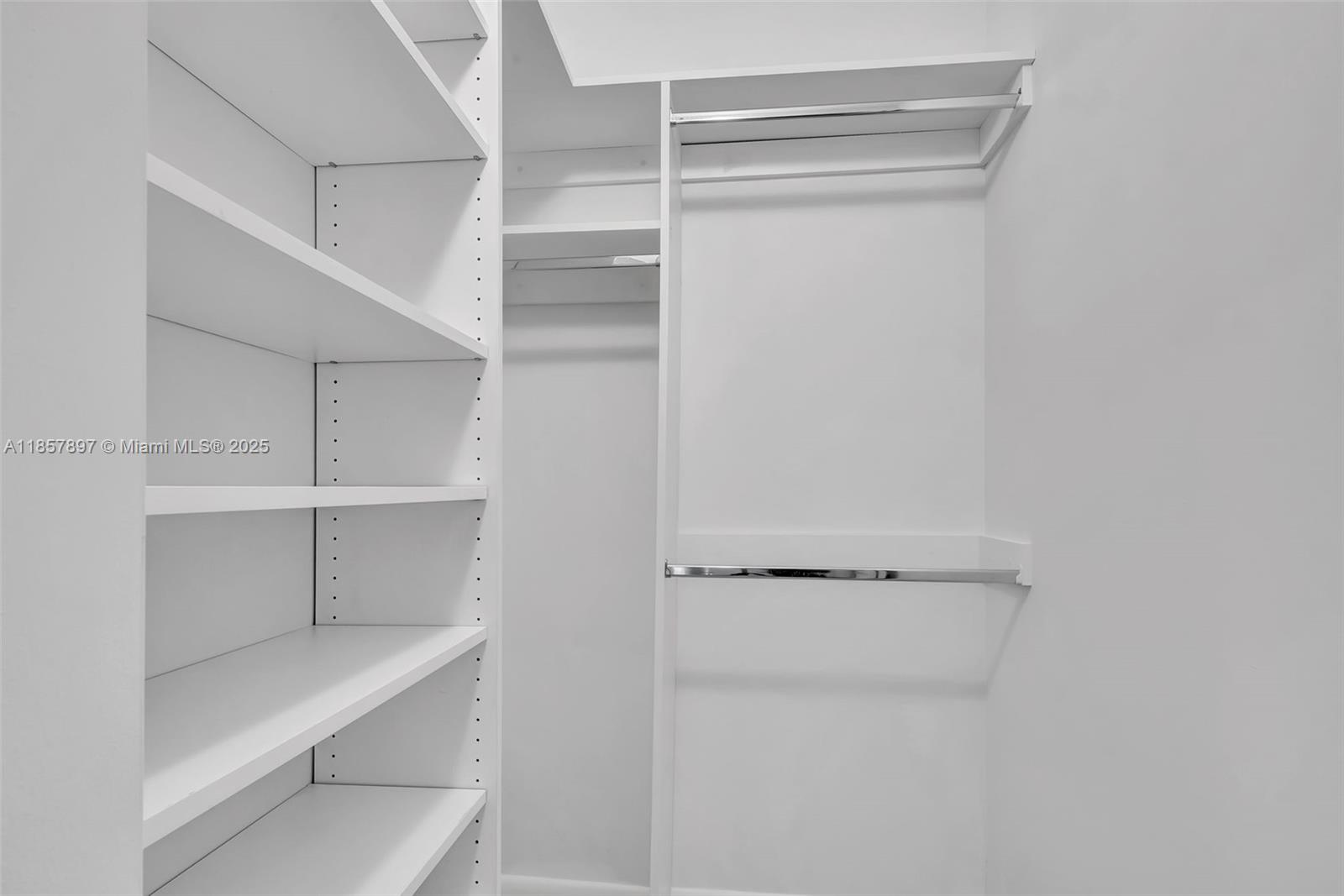 848 Brickell Key Drive, Unit 2602 Miami, FL 33131 - Photo 30 of 40 a view of walk in closet with empty racks