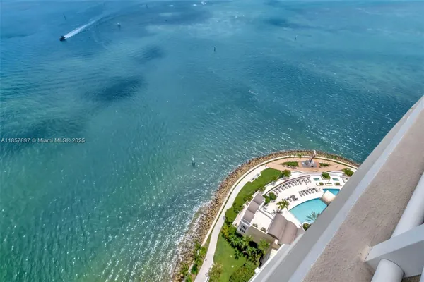 a view of swimming pool from a balcony