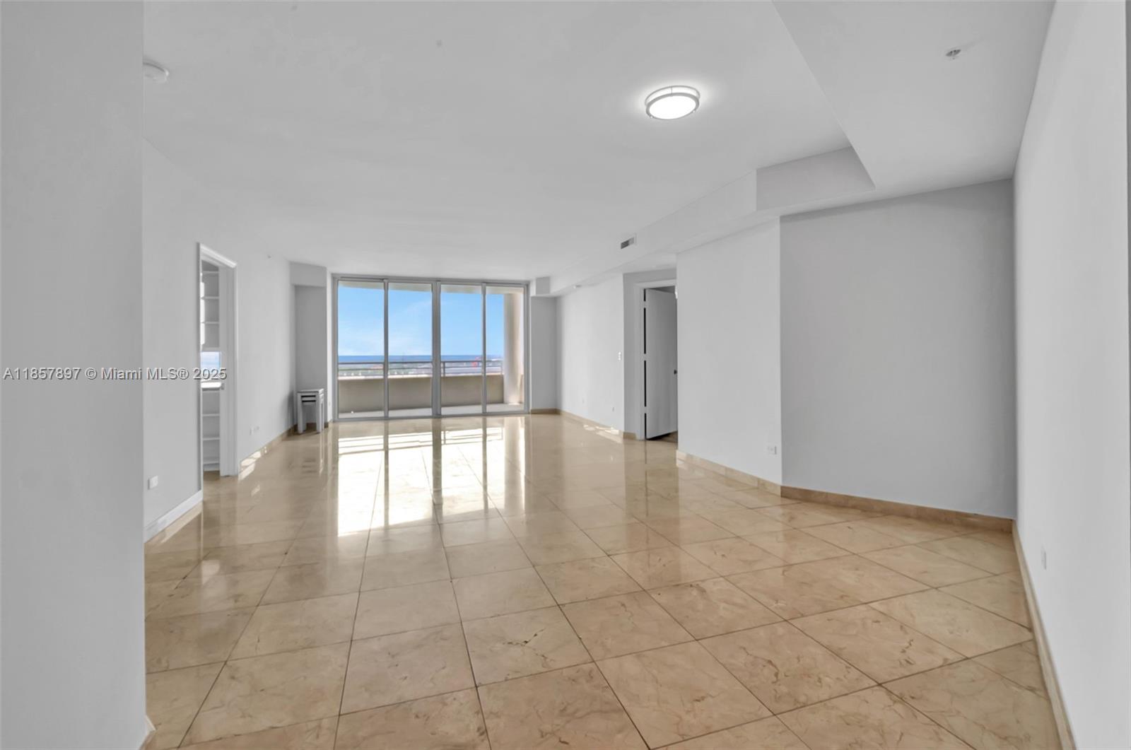848 Brickell Key Drive, Unit 2602 Miami, FL 33131 - Photo 10 of 40 a view of an empty room with a window