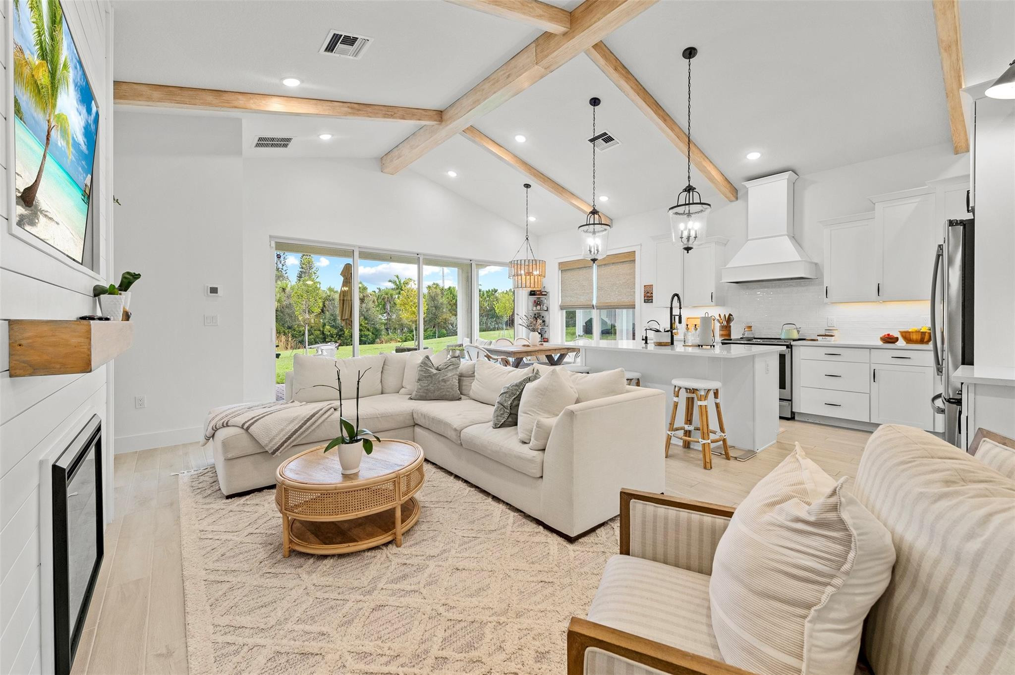 121 Southeast Rocky Terrace Stuart, FL 34997 - Photo 1 of 45 a living room with furniture and a large window