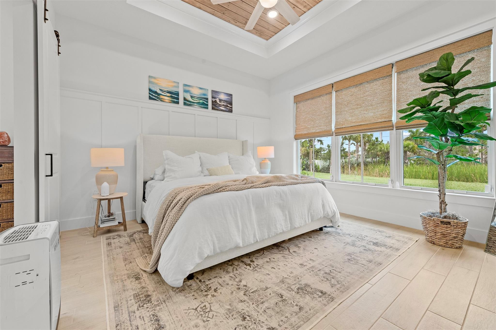 121 Southeast Rocky Terrace Stuart, FL 34997 - Photo 11 of 45 a bedroom with a large bed and a window