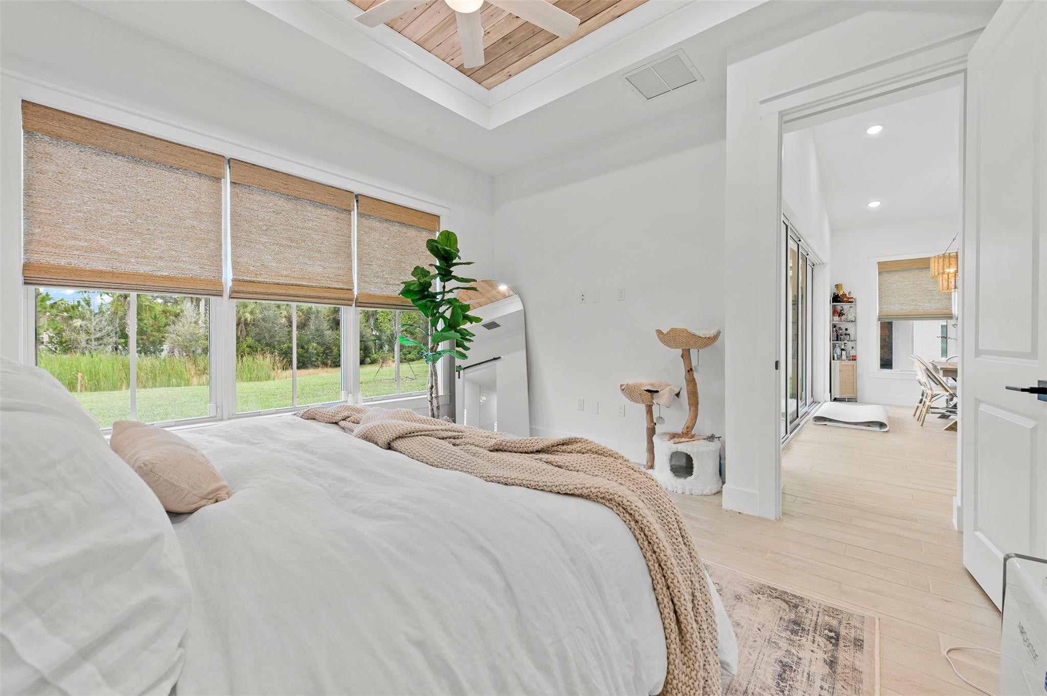 121 Southeast Rocky Terrace Stuart, FL 34997 - Photo 12 of 45 a bedroom with a bed and a large window