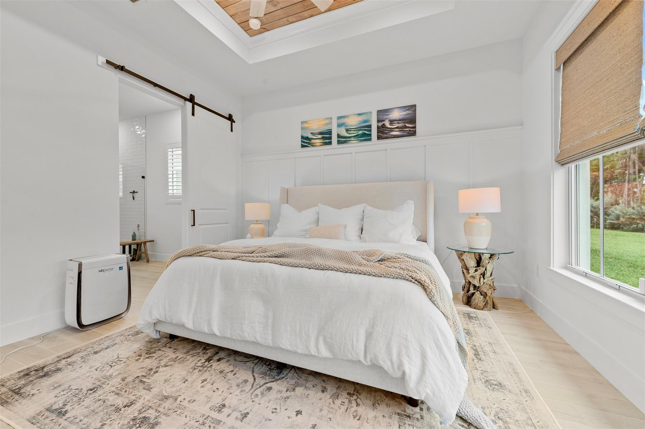 121 Southeast Rocky Terrace Stuart, FL 34997 - Photo 13 of 45 a bedroom with a bed and a window