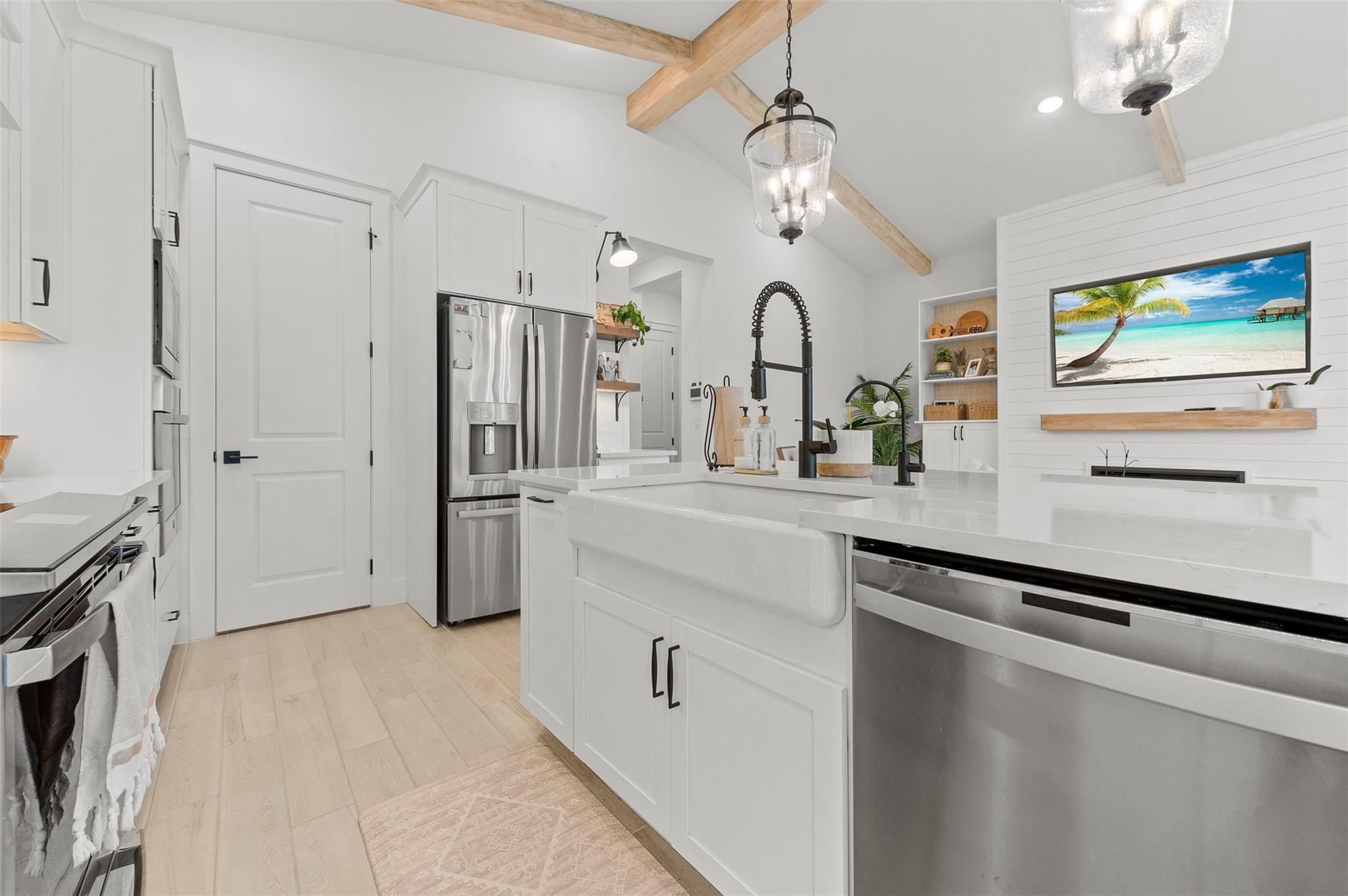 121 Southeast Rocky Terrace Stuart, FL 34997 - Photo 23 of 45 a kitchen with stainless steel appliances a refrigerator and a stove