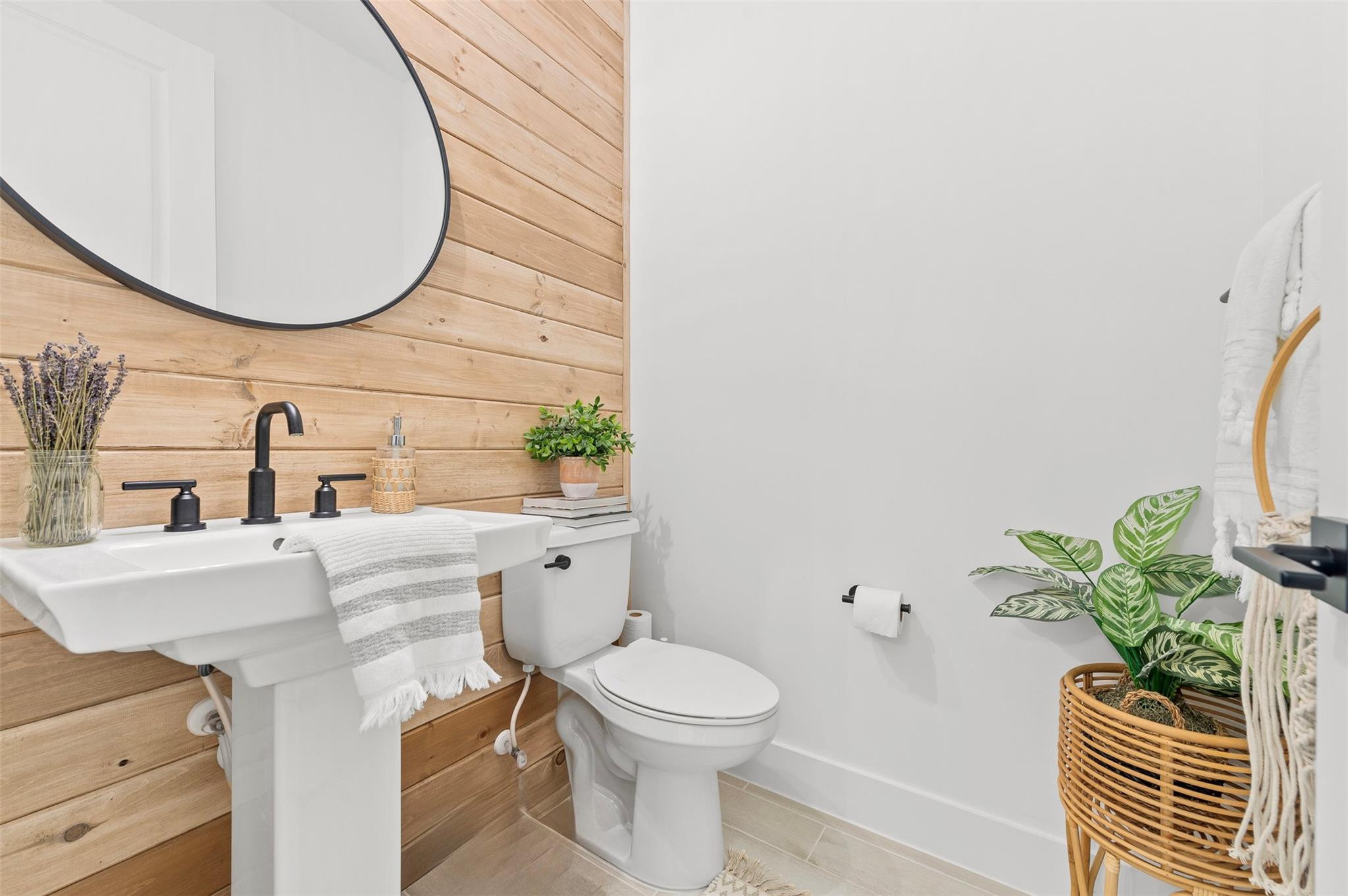 121 Southeast Rocky Terrace Stuart, FL 34997 - Photo 25 of 45 a bathroom with a sink a toilet and a mirror