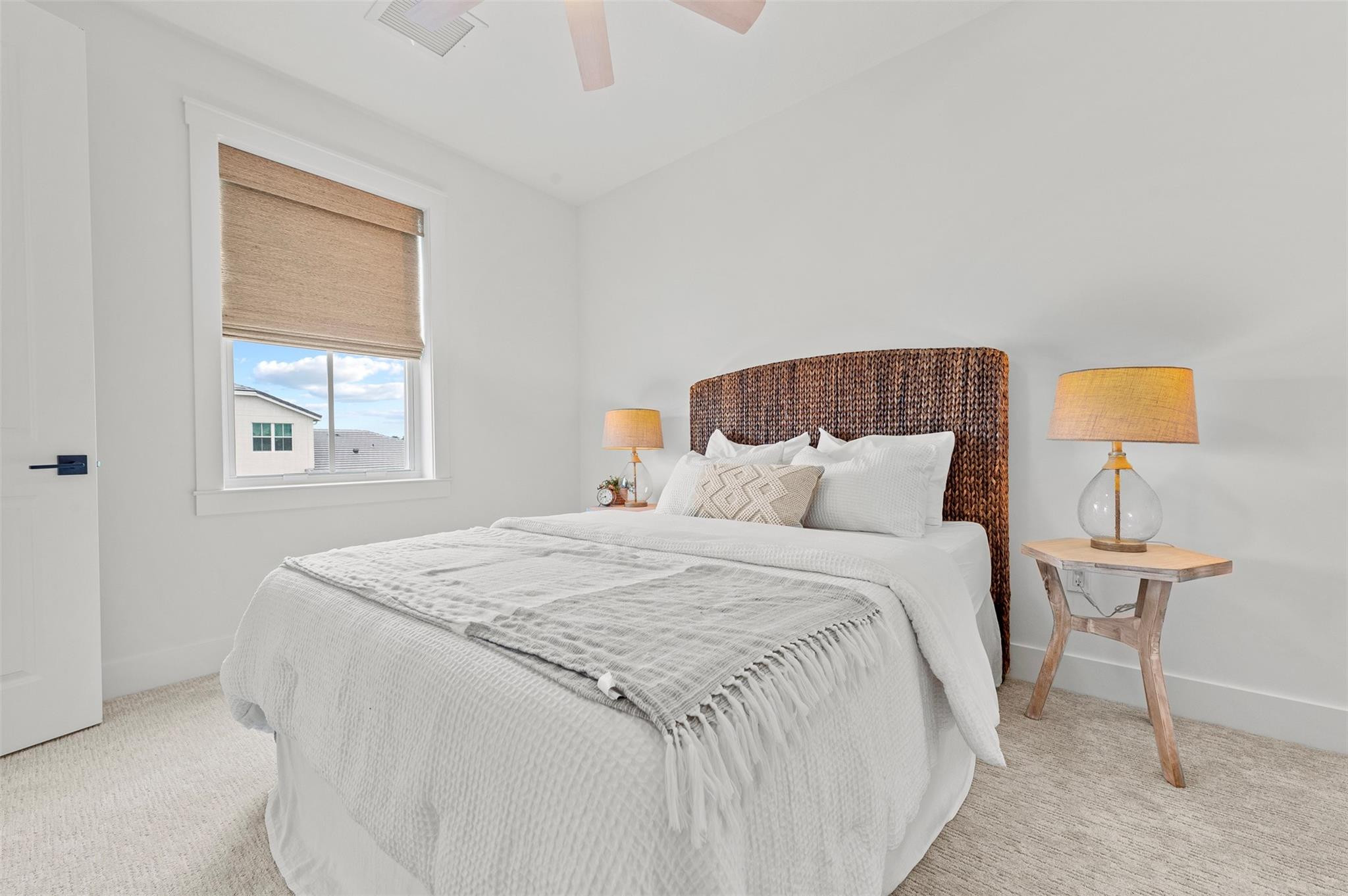 121 Southeast Rocky Terrace Stuart, FL 34997 - Photo 27 of 45 a bed room with a bed and a night stand