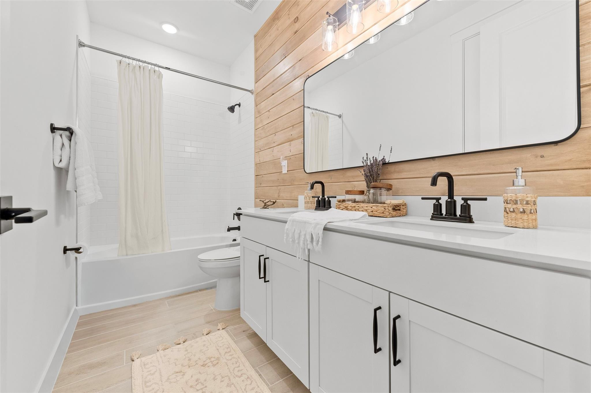 121 Southeast Rocky Terrace Stuart, FL 34997 - Photo 29 of 45 a bathroom with a sink a toilet and shower