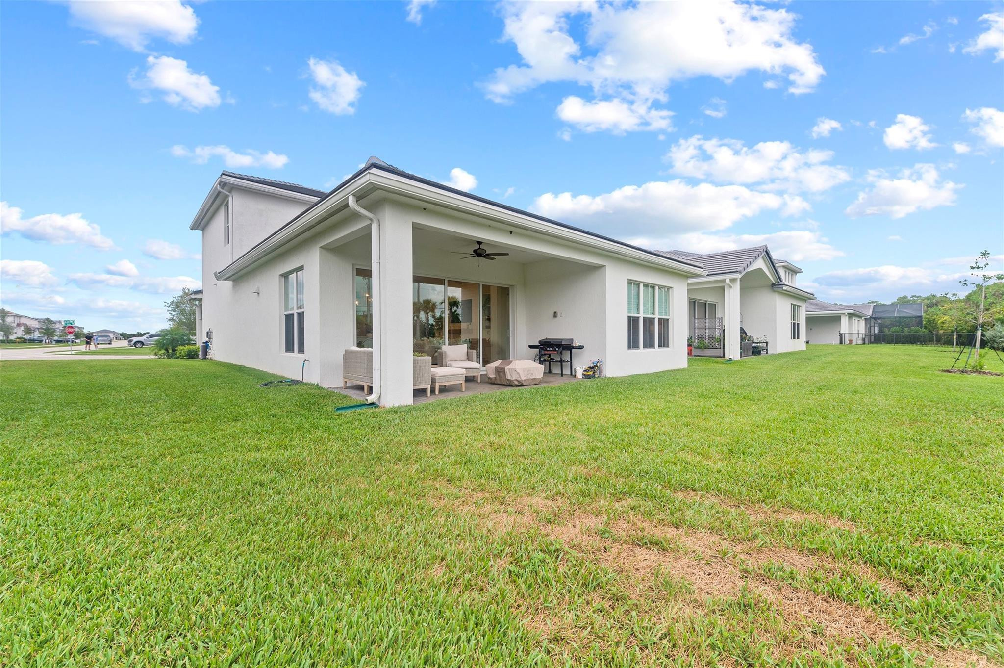 121 Southeast Rocky Terrace Stuart, FL 34997 - Photo 34 of 45 a view of a house with backyard and garden