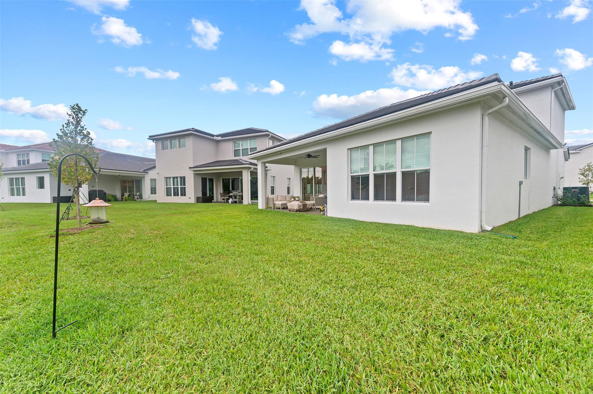 121 Southeast Rocky Terrace Stuart, FL 34997 - Photo 35 of 45 a house view with a garden space