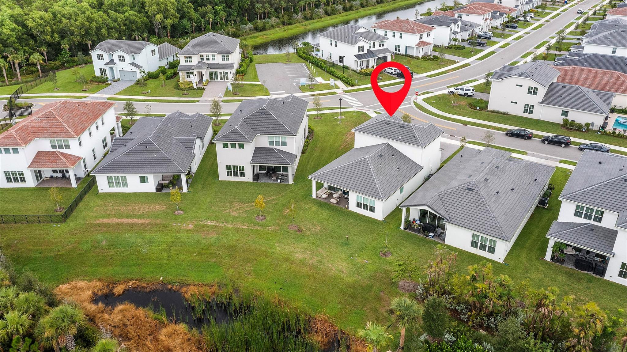 121 Southeast Rocky Terrace Stuart, FL 34997 - Photo 41 of 45 an aerial view of residential houses with outdoor space and parking
