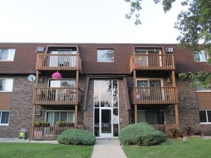 a front view of residential houses with yard