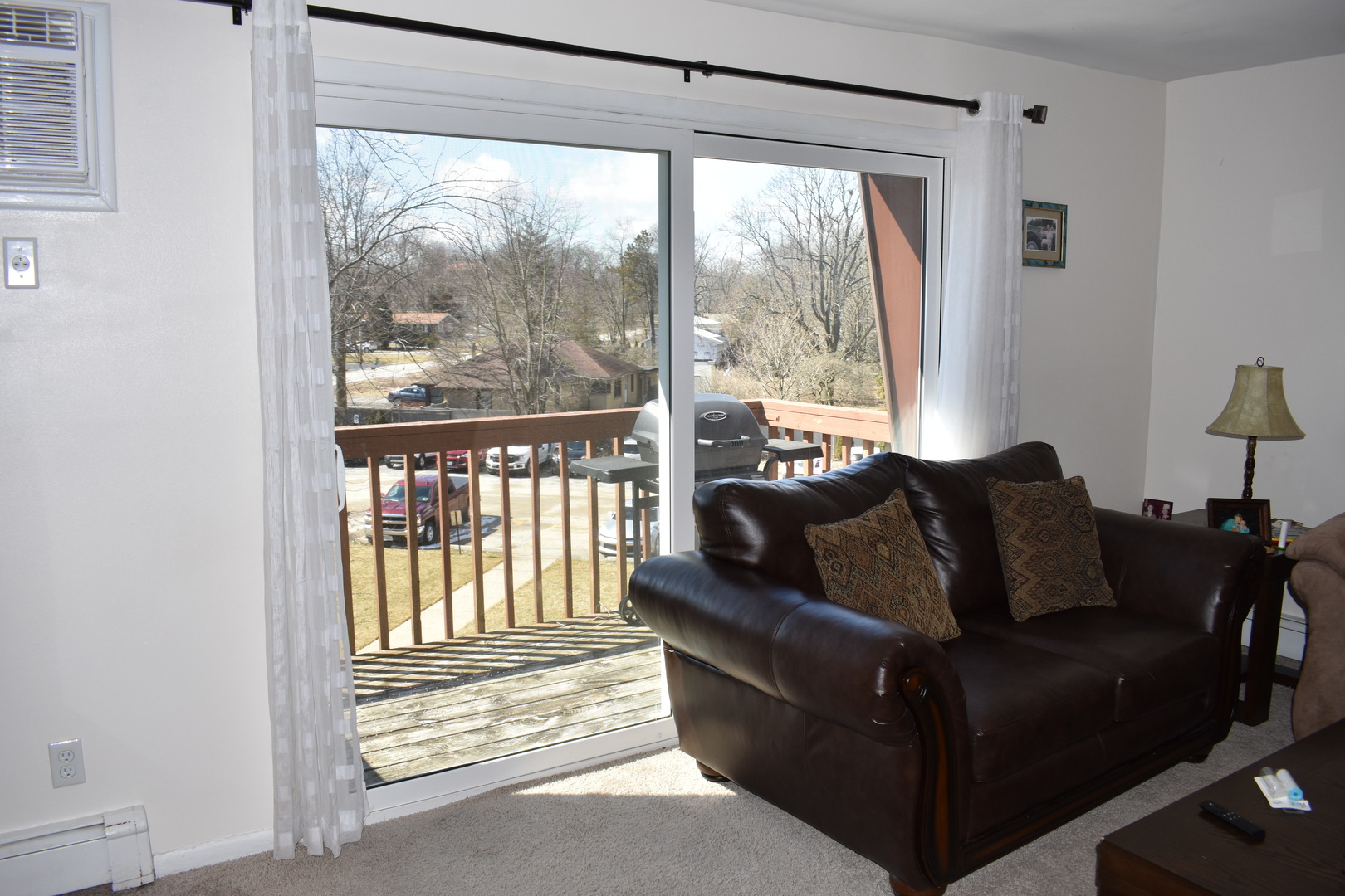 19380 Wolf Road, Unit 9 Mokena, IL 60448 - Photo 6 of 13 a living room with furniture and a floor to ceiling window