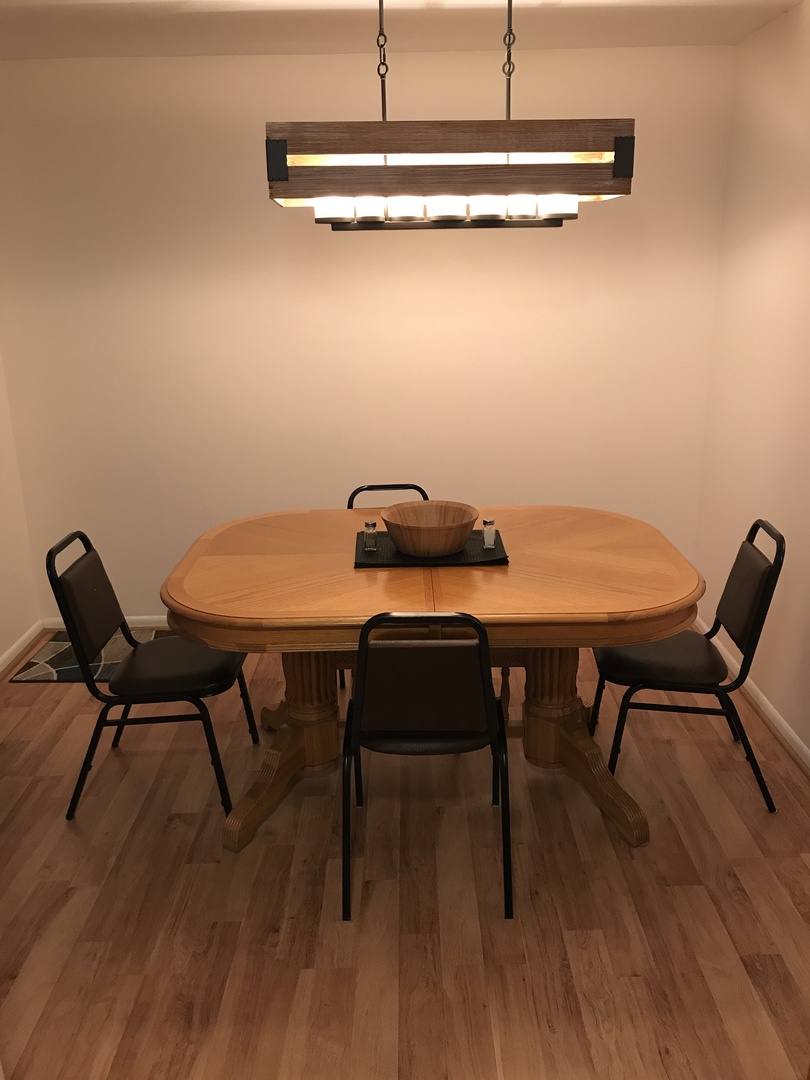 19380 Wolf Road, Unit 9 Mokena, IL 60448 - Photo 8 of 13 a view of a dining room with furniture and wooden floor