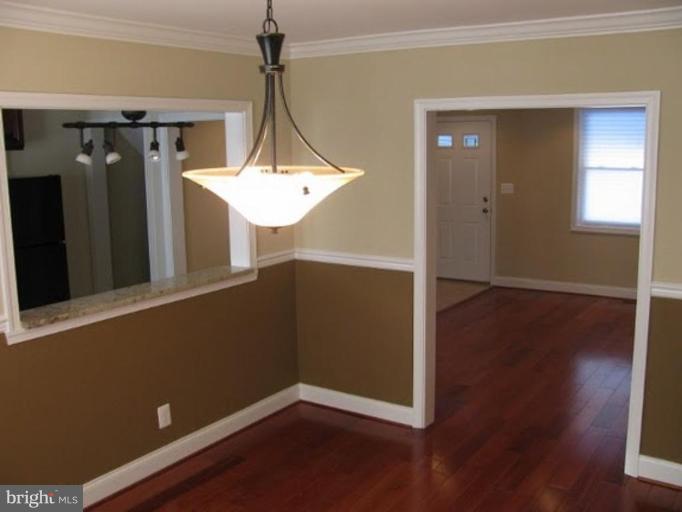 1629 Northgate Road Baltimore, MD 21218 - Photo 4 of 29 a view of a hallway with wooden floor