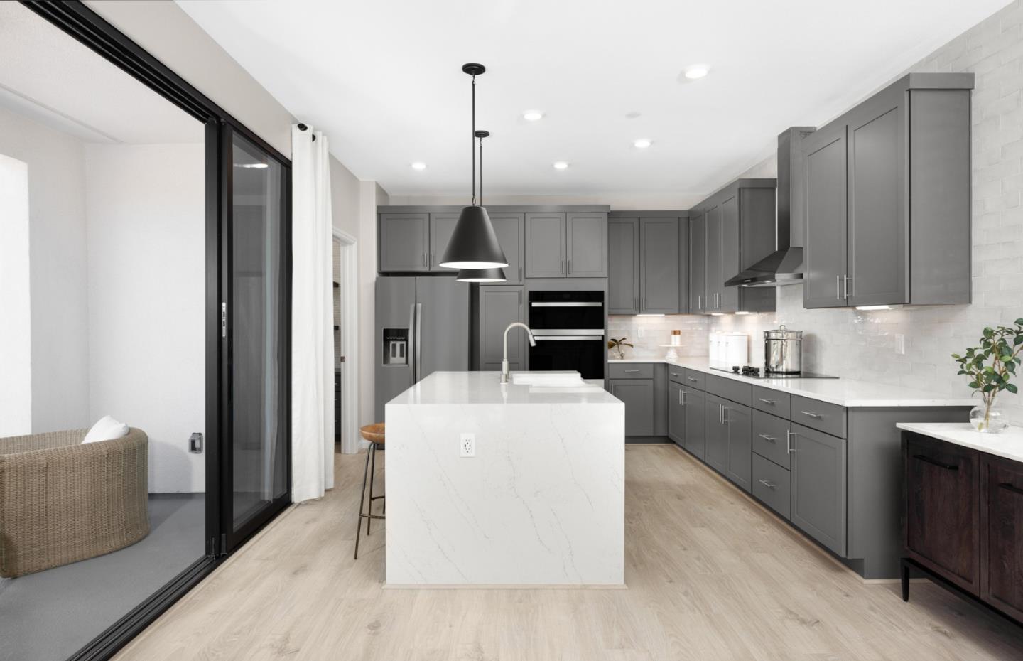 1145 Milan Terrace, Unit 9 Sunnyvale, CA 94089 - Photo 18 of 20 a large kitchen with stainless steel appliances kitchen island granite countertop a stove a sink a refrigerator and a cabinets