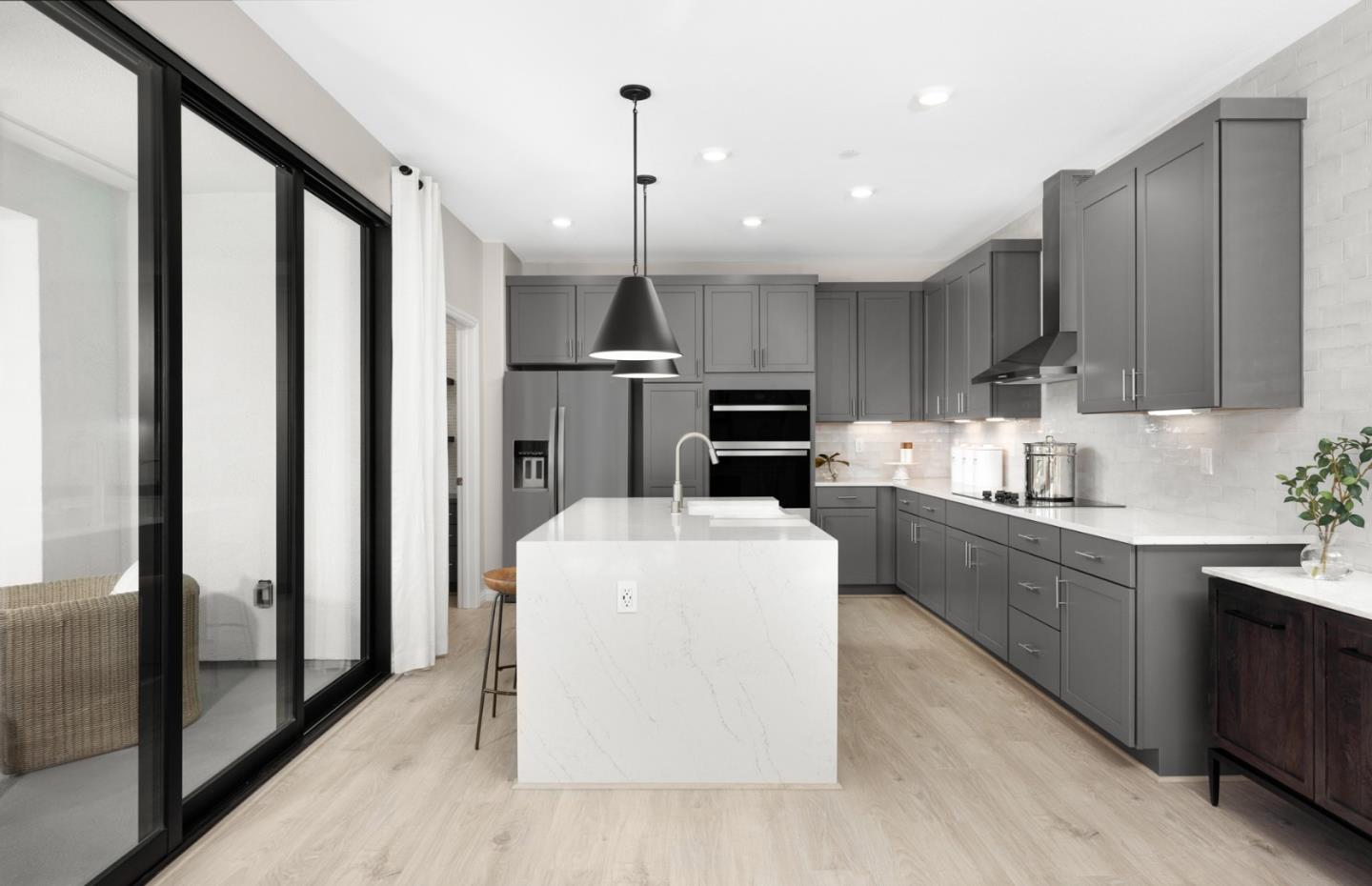 1145 Milan Terrace, Unit 9 Sunnyvale, CA 94089 - Photo 9 of 20 a large kitchen with stainless steel appliances kitchen island granite countertop a stove a sink a refrigerator and a cabinets