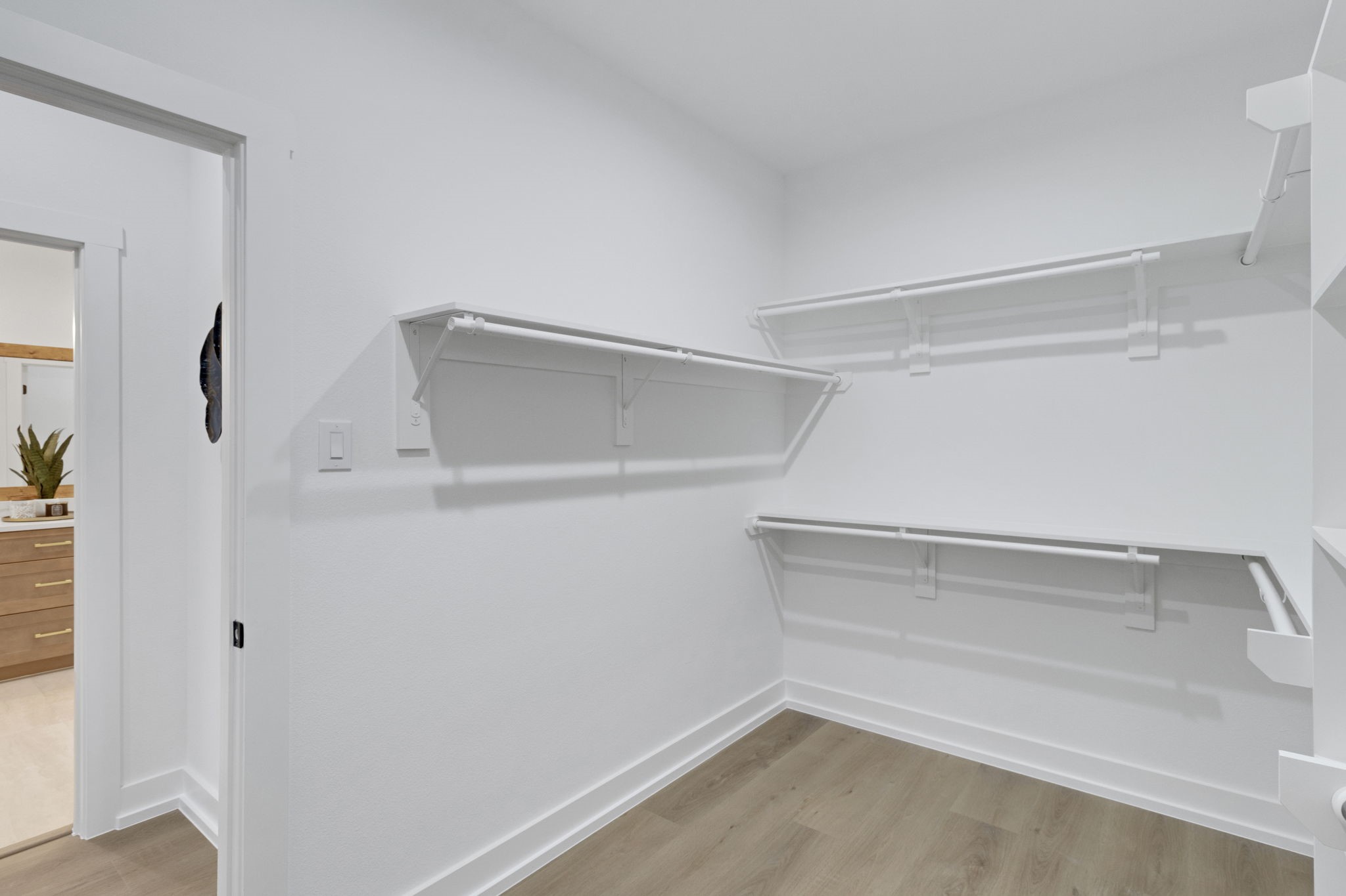 4202 Plaag Street Houston, TX 77016 - Photo 29 of 38 Generous walk-in closet with built-in shelving and ample hanging space.