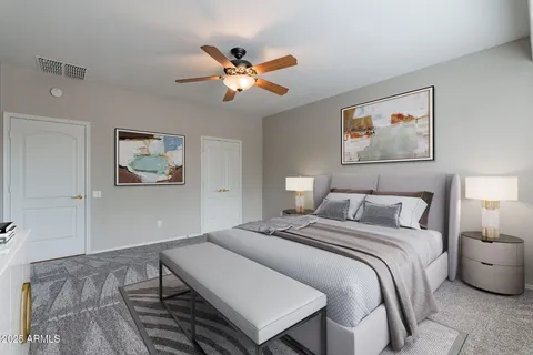 a bedroom with a bed and a chandelier