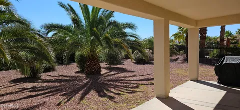 a view of a patio with couple of chairs
