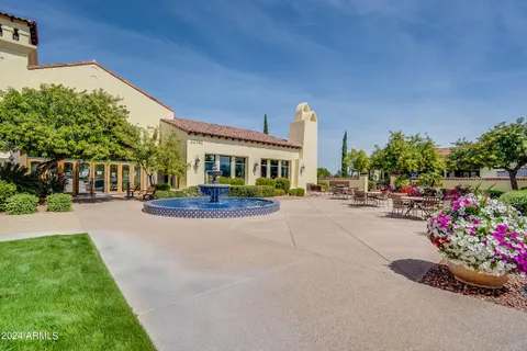 a front view of a house with lake view and a garden
