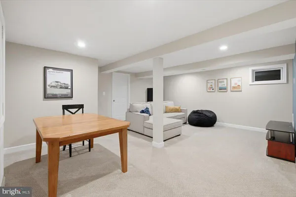 a room with a bed and a dresser