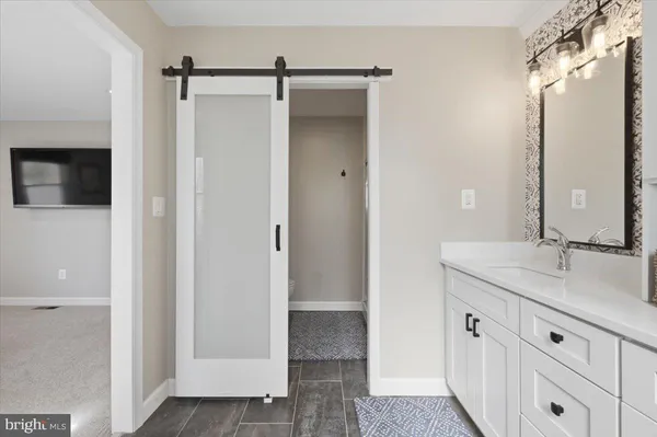 a bathroom with a sink a toilet and a bathtub