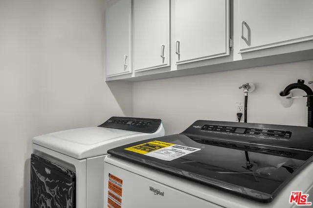 a stove top oven sitting inside of a kitchen